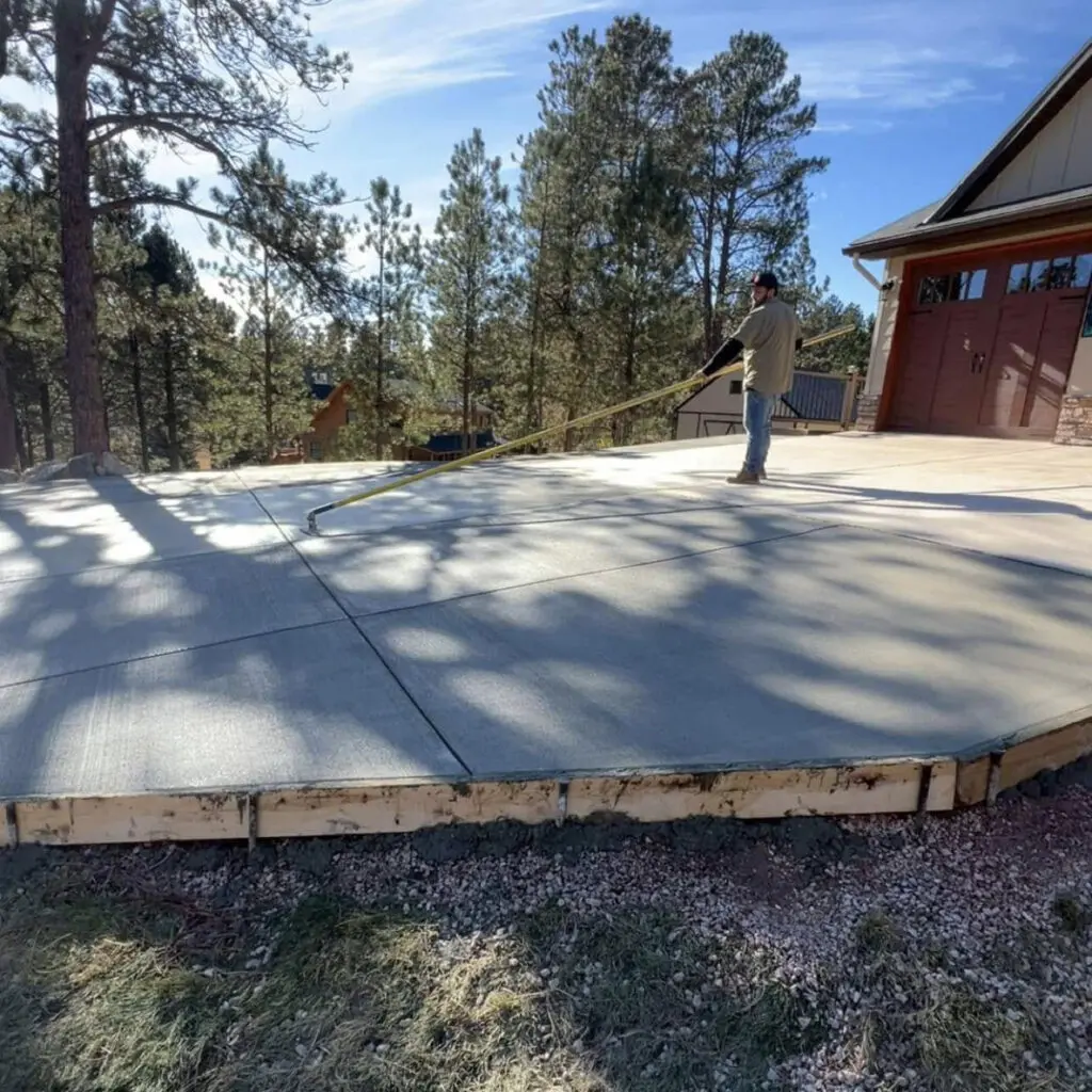 Xtreme Concrete - Contractor finishes a new concrete driveway