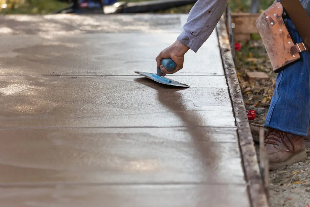 Xtreme Concrete Contractors Leveling a Sidewalk Concrete Form